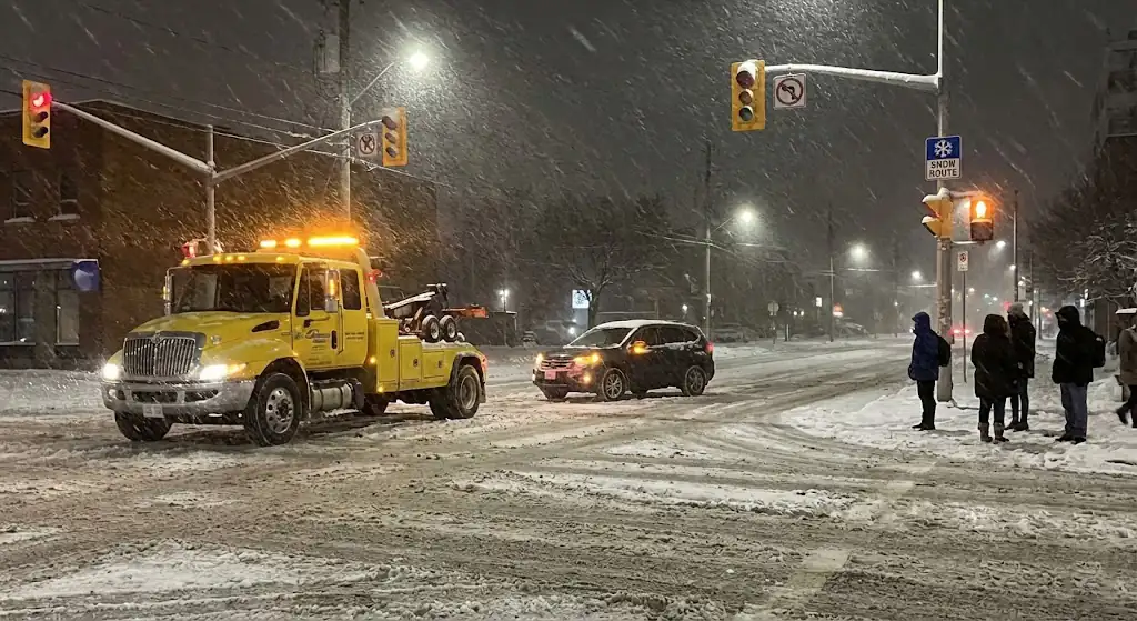 securing car on top of flatbed tow truck